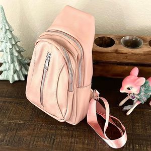 PINK FAUX LEATHER SMALL SLING BACKPACK NWT